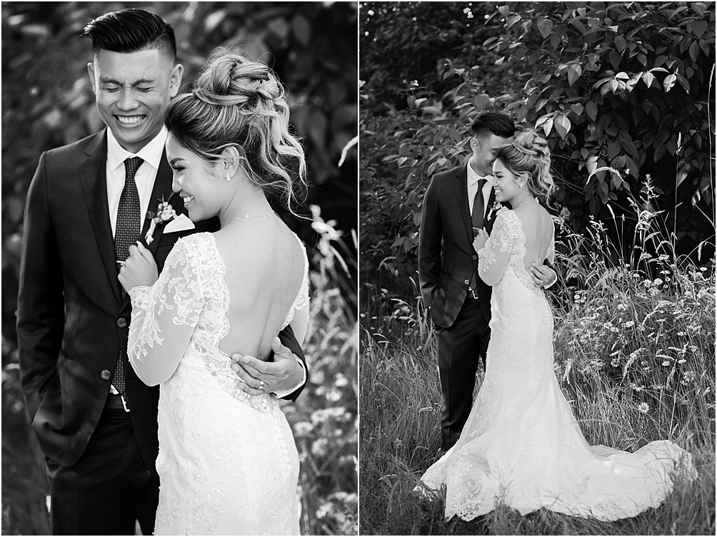 a black and white photo of a bride and groom sharing a laugh