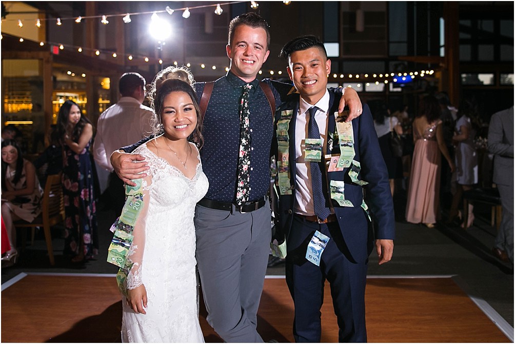 Clint Bargen from Clint Bargen Photography poses with a newly married couple