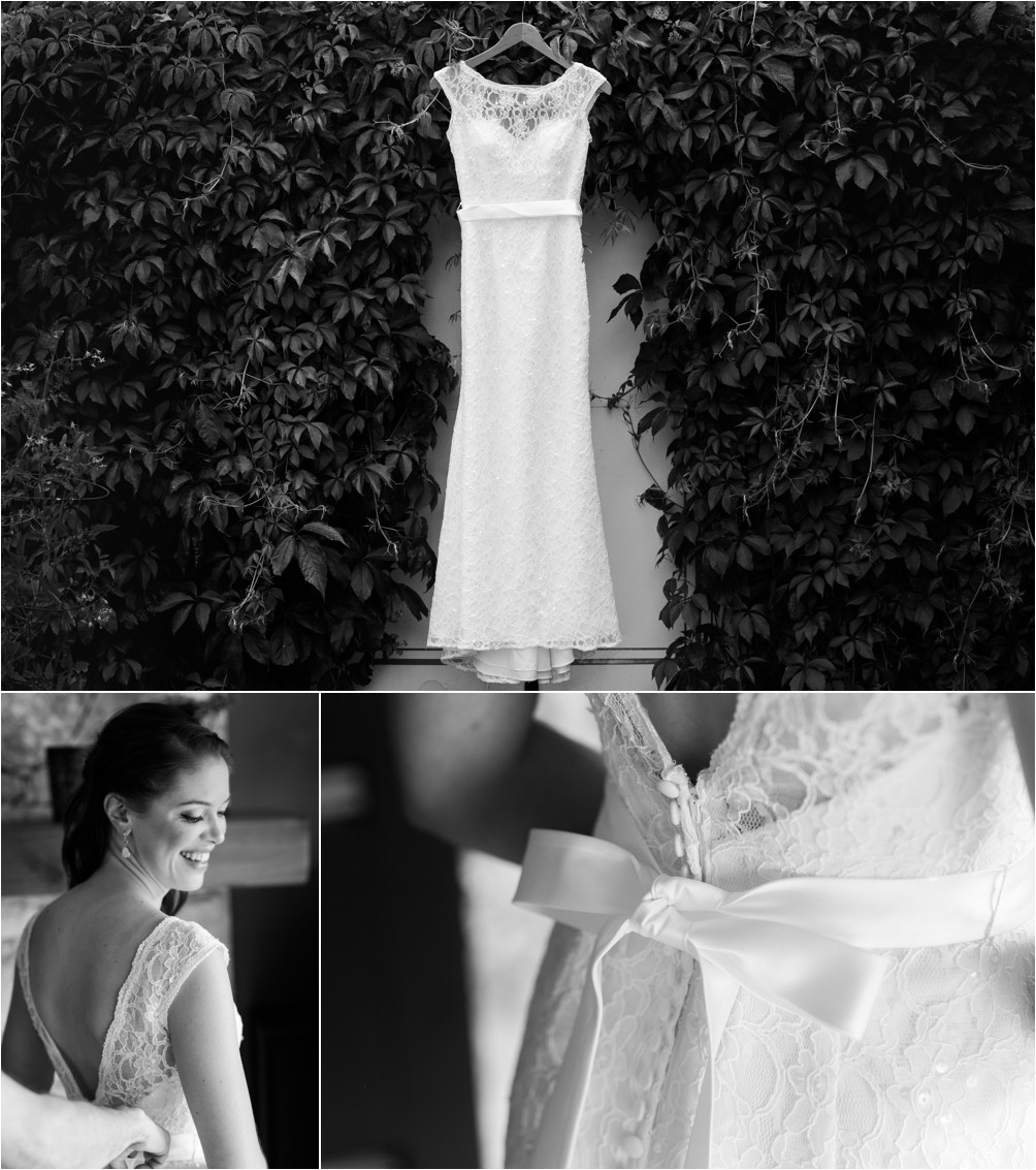 A wedding dress hangs amongst a hedge of leaves in Burnaby by Clint Bargen Photography.