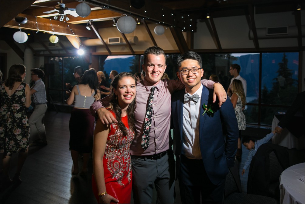 Clint Bargen of Clint Bargen Photography poses for a photo with Abraham and Fiona on their wedding day at the Diamond Alumni Centre at Simon Fraser University.